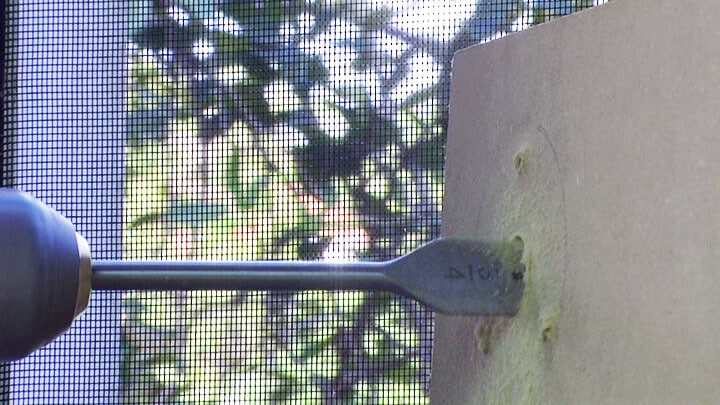 Drilling a hole for security camera installation